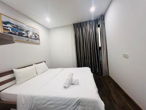 Postel nebo postele na pokoji v ubytování Ha Đo Centrosa Building , Ba Thang Hai street, distrist 10