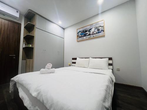 Postel nebo postele na pokoji v ubytování Ha Đo Centrosa Building , Ba Thang Hai street, distrist 10
