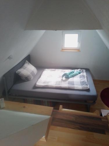 a bed in a small room with a window at Happy Villa Ferienhaus in Olsberg
