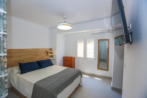 Ένα ή περισσότερα κρεβάτια σε δωμάτιο στο Casa Iglesia