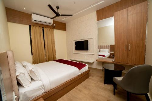 TV a/nebo společenská místnost v ubytování Hotel The Pearl