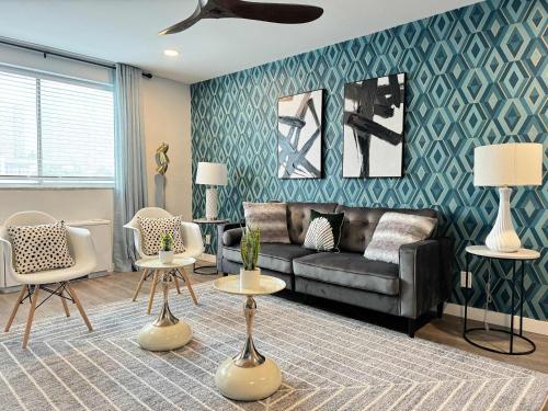 a living room with a couch and chairs at Downtown New-Built Roof-top balcony City View 525Pkwy in Atlanta
