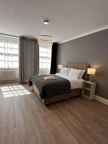 Postel nebo postele na pokoji v ubytování Walker Apartment