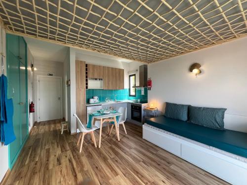 a living room with a couch and a table at Caniçal houses - Madeira in Caniçal