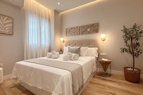 Ένα ή περισσότερα κρεβάτια σε δωμάτιο στο Aljara Suites