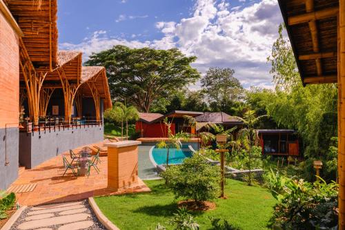 a view of the backyard of a house with a swimming pool at Kawa Bamboo Retreat in Pereira