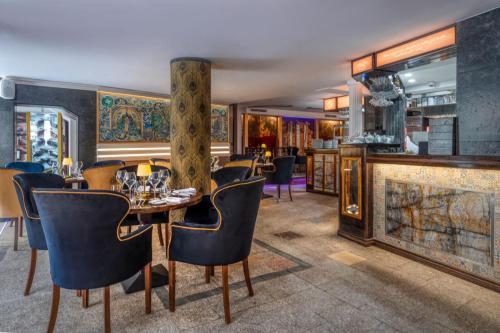 a dining room with a table and chairs at Czeczotka Palace Apartments in Kraków