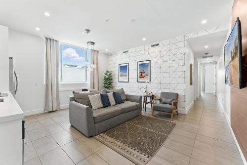 a living room with a couch and a table at MILLA South Beach in Miami Beach