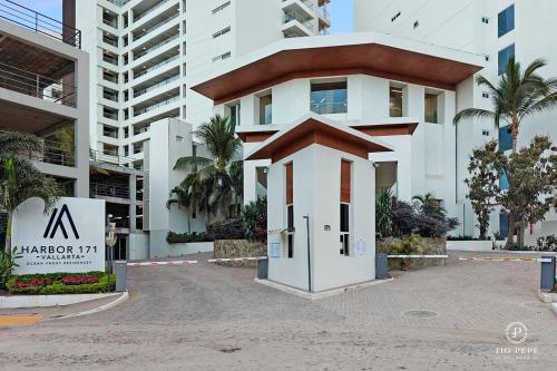 a building with a small entrance in front of it at Harbor Puerto Vallarta 1006 in Puerto Vallarta