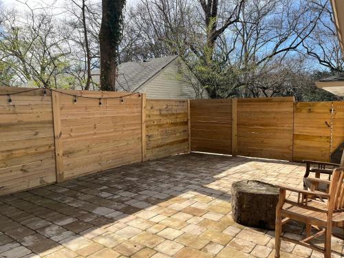 a wooden fence in front of a patio at La Casa de Tutti in Decatur