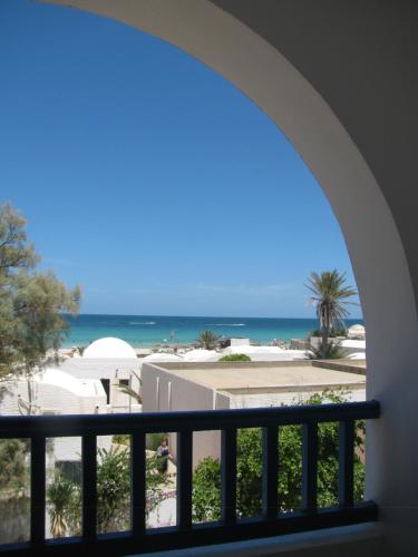 a view of the beach from a balcony at Dar Salem in Djerba