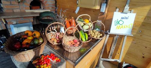 a bunch of baskets of fruits and vegetables on a table at Tweet Apartments with Sauna and optional Breakfast Close To Terme Sveti Martin in Štrigova