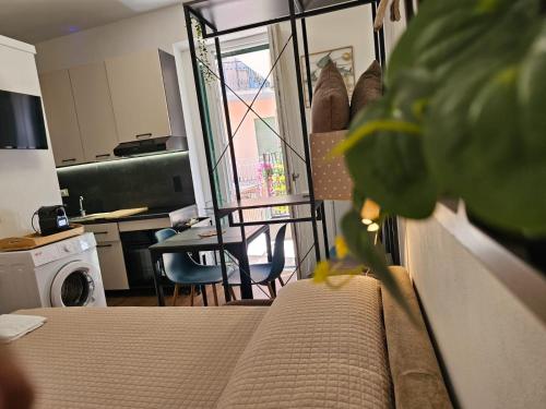 a room with a bed and a kitchen with a table at MareMy Vasto Centro in Vasto