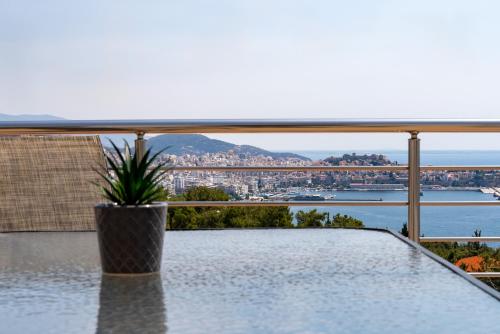 a view of the city from the balcony of a house at Seametry premium residencies Kavala in Kavála