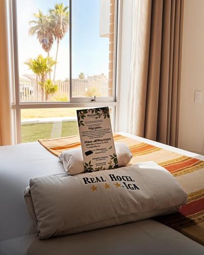 Ένα ή περισσότερα κρεβάτια σε δωμάτιο στο Real Hotel Ica