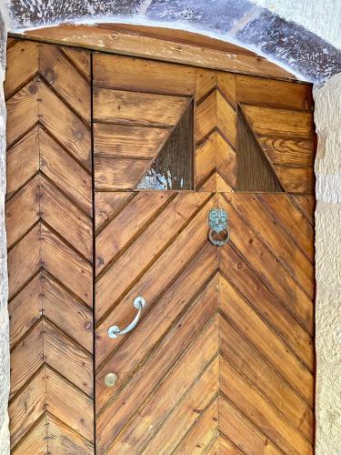 a wooden door with a handle on top of it at Traditional Holiday Home in the Heart of Nadur in Nadur