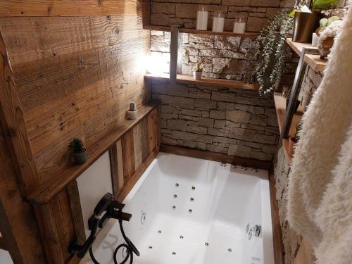 an overhead view of a bath tub in a room at Suite Balneo Les Boutons d'or Font Romeu in Font-Romeu