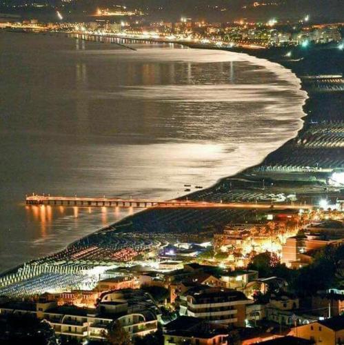 a view of a beach at night with a city at MareMy Vasto Centro in Vasto