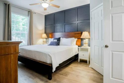 a bedroom with a large bed with a large headboard at Mickey's Welcome Inn - Closest Resort to Disney in Orlando