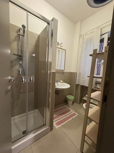 a bathroom with a shower and a sink at SulMare Alba Adriatica in Alba Adriatica