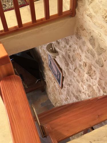 a view from the top of a stairwell with a picture on the wall at Traditional Holiday Home in the Heart of Nadur in Nadur