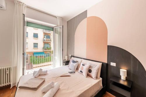Giường trong phòng chung tại Boccadasse Luxury Home - Mare - Stazione - Comfort