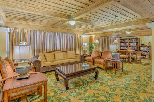 a living room with a couch and chairs and tables at Coastal View Terrace in Palm Beach