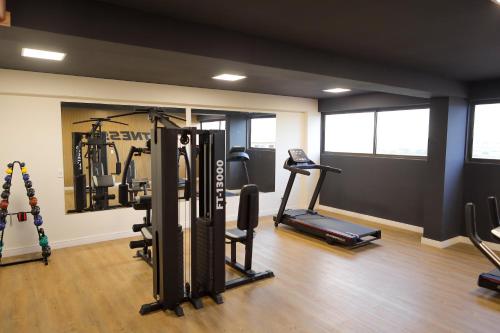 a gym with cardio equipment in a room at ORA Beach Residence by AFT in Porto De Galinhas