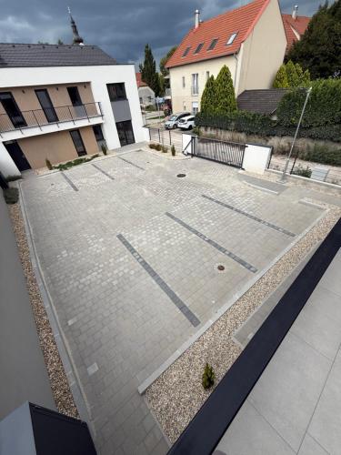 an empty parking lot in front of a building at Dream Premium Apartman in Mosonmagyaróvár