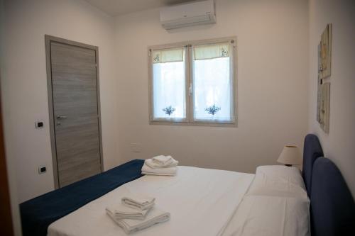 Ένα ή περισσότερα κρεβάτια σε δωμάτιο στο Hibiscus B&B