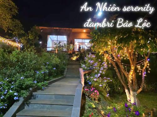a garden at night with a sign that reads an million security daughter bias lobe at An Nhien Serenity in B'su M'rac