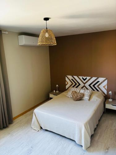 Ένα ή περισσότερα κρεβάτια σε δωμάτιο στο Maison avec terrasse et jardin - proche Montpellier et plages