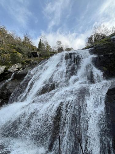 a waterfall on the side of a river at Casa Rural La Abuela Obdulia in Piornal