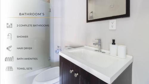 a bathroom with a sink and a toilet and a mirror at 501 Zocalo 3Bdrm 2bath Rooftop in Mexico City