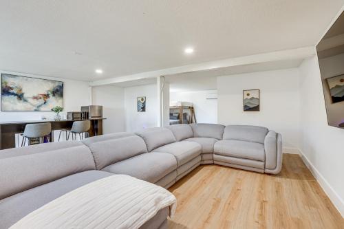 a living room with a couch and a table at Boat, Fish and Swim Lake Conroe Home with Hot Tub! in Willis