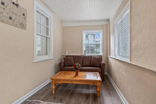 a living room with a couch and a coffee table at # Stay At Our Tasteful, Private, & Elegant Abode # in Devon