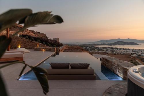 a couch sitting on the roof of a house at GkF Luxury Villas in Naxos Chora