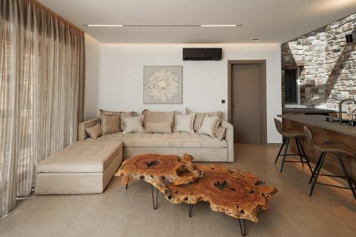 a living room with a couch and a table at GkF Luxury Villas in Naxos Chora