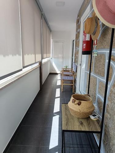 a room with a table with a basket on it at Casa dos Valentes in Bicas