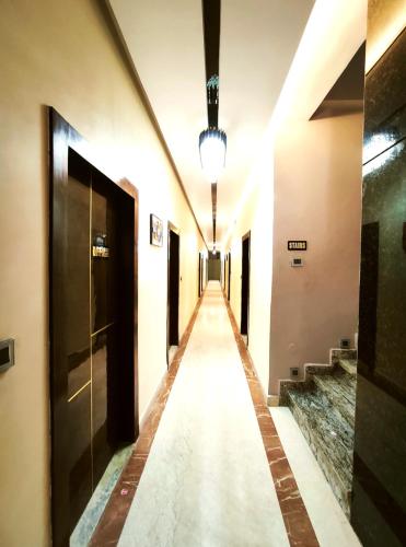 a long hallway in a building with a light on at The Shri Shyam Prime Main Har Ki Pauri Haridwar in Haridwār