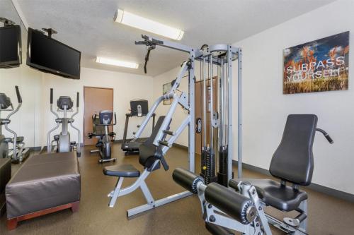 a gym with treadmills and machines in a room at Best Western Tolleson in Phoenix