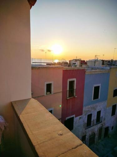 a view of the sunset from a balcony of a building at Appartamento I TRE SANTI in Bisceglie