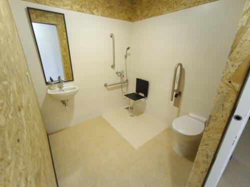 a bathroom with a toilet and a sink at Hostel Elios in Lorca