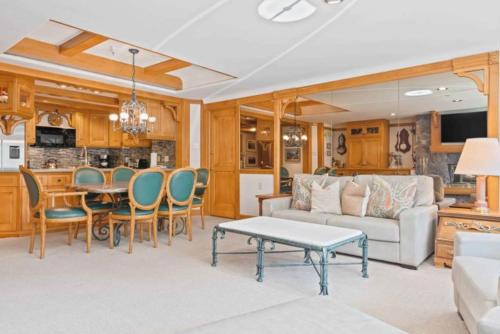 a living room with a couch and a table at Lodge Tower 387 Three Bedroom Residence in Vail