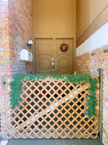 a front door of a house with a wooden fence at Happy Home in Orlando