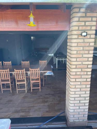 a brick pillar with chairs and a table in a room at House with pool and great location in Severínia