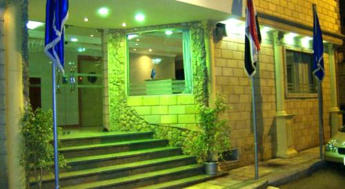 a building with stairs in front of a building at Alexandria Mediterranean Suites in Alexandria