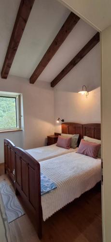 a bedroom with two beds and a window at ISTRIAN vibeS in Drenje