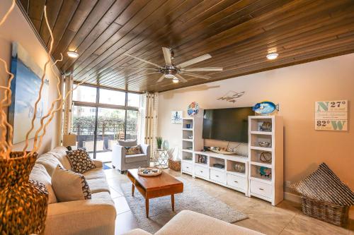 a living room with a couch and a tv at Upgraded and Spacious Harbor Towers Condo! Siesta Key Vacation! in Siesta Key