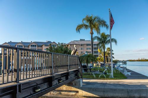 a bridge over a body of water with a flag at Upgraded and Spacious Harbor Towers Condo! Siesta Key Vacation! in Siesta Key